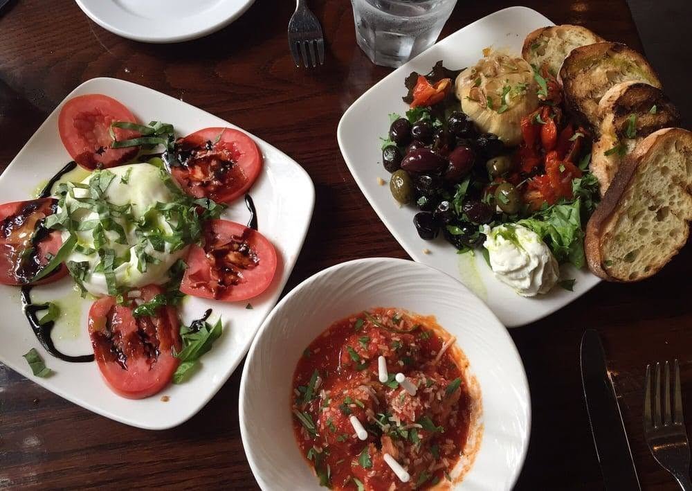 An Italian spread of caprese, antipasti and meatballs