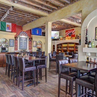 Vino Napoli wine bar interior with Italian regional flags