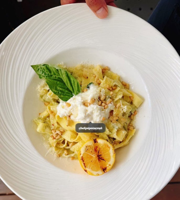 Fresh pappardelle with burrata, pine nuts and grilled lemon