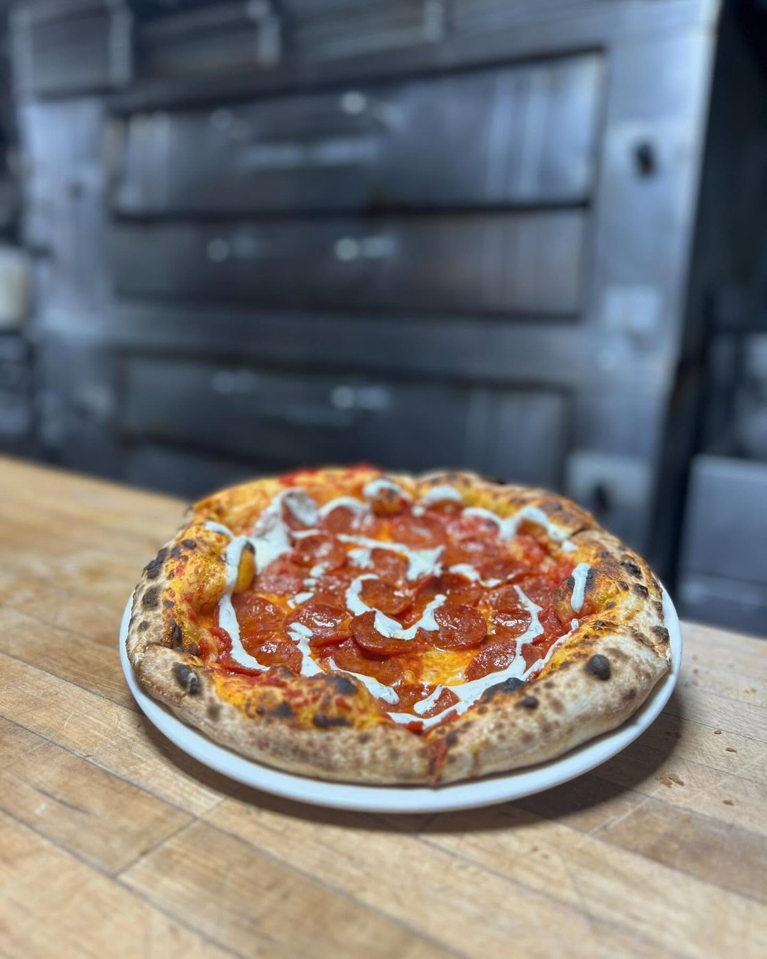 Pepperoni Neapolitan pizza fresh from the wood-fired oven